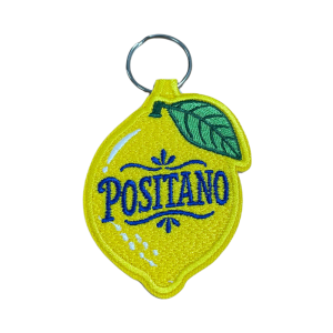 Porta-chaves bordado com design em formato de limão, inspirado na cidade de Sorrento, em Itália.